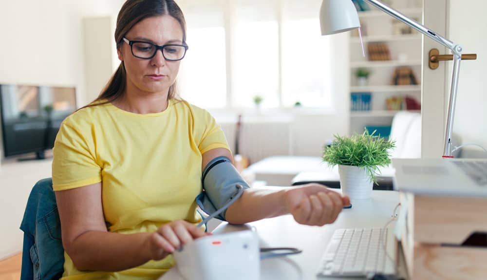 Woman checking blood pressure